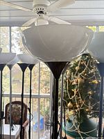 close view of bowl shade and upper pole