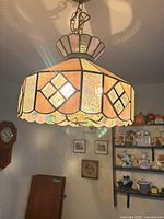 Pendant showing stained glass shade lit