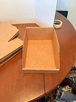 One bin assembled showing brown corrugated construction and open front