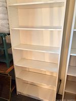 Full front view of white bookcase
