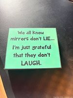 Front view showing full text on green background