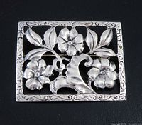 front view of sterling silver rectangular openwork floral brooch