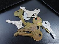 Group of mixed keys on black background