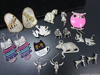 All jewelry items laid out on black surface