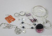 Overhead view of full lot displaying all 12 sterling jewelry pieces