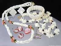 All six mother-of-pearl jewelry items arranged together