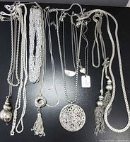 All necklaces laid flat showing pendants and chain styles