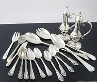 Group shot of all flatware and shakers