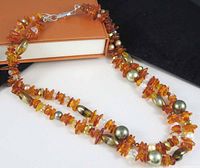 Full view of double-strand necklace laid out showing bead variety and sterling clasp