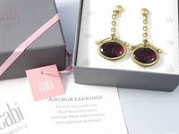 Earrings in Cabi box with tag and info card displayed