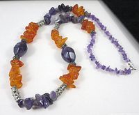 Full view of necklace showing amber, amethyst chips and silver-tone spacers