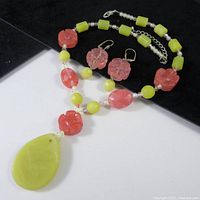 Full view of necklace and earrings showing overall design and colour