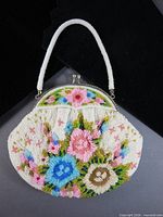 Full view of floral beaded handbag with handle