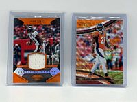 Fronts of both Aqib Talib numbered cards in sleeves