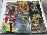 Group shot of six assorted comic books showing covers