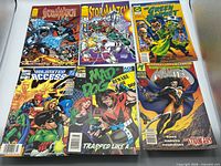 All six comic books laid out in two rows