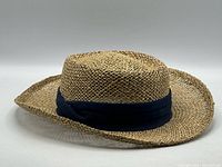Full view side profile of straw gambler hat with navy band