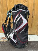 Front and side view of PowerBilt golf bag showing logo, pockets, straps