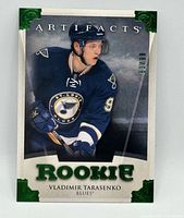 Front view of Vladimir Tarasenko 2013-14 UD Artifacts Emerald Rookie card showing player image, Emerald foil corners, serial number 63/99