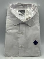 Front view of sealed white dress shirt with label visible