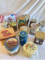 All 14 tins assorted shapes and designs displayed