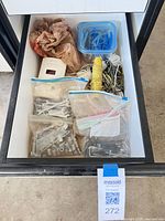 Drawer with bags of wrenches, sockets, fasteners, ropes, clips tub, detector
