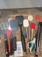 Full set of utensils laid out on countertop