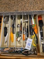 Drawer view showing entire assortment of utensils in organizers