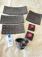 Entire set laid out showing three rectangular trays, one square plate, two candle holders with red candles, and bowl