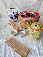 All items overview: teapot, cups, basket, chopsticks, mat, acrylic boxes, book