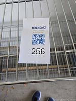 Close-up of wire shelf and chrome finish with lot tag