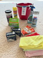 All items grouped showing bucket, sprays, wipes, cloths, polish kits, Affresh box, Tide sachets