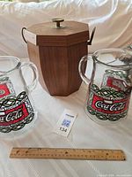 Lot overview showing both pitchers, ice bucket, scale reference