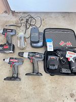 Overall view of all tools, chargers, batteries, bit jar and bag
