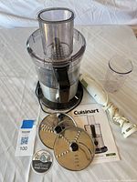 Food processor, immersion blender, discs, manual and beaker grouped