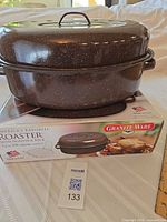 Roaster with lid on box showing overall view