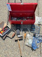 Overall lot with toolbox open and surrounding tools