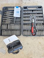 Complete lot showing both Husky bit cases with driver handle and Master Lock padlock