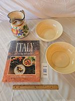 All items together: cookbook, pitcher, two bowls with ruler for scale
