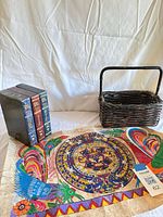 All items together: three DVD sets, wicker basket, Mexican calendar print