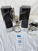 All speakers, cables, power adapter overview