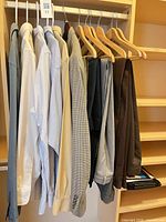 Full view of all garments on hangers: blazer, shirts and slacks