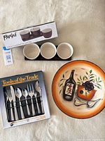 Group shot showing boxed flatware, Parini condiment set box with bowls & tray, and decorative pasta plate