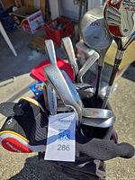 Clubs inside bag showing woods, irons and headcovers