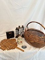 All items grouped: wicker basket, candle holders, tea jar, fan, coaster holder