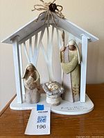 Full view of nativity set showing all four components assembled