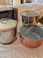 All three stockpots with lids and box