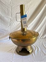 Full view of brass steamboat hot pot with lid, chimney and base