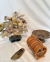 Group shot showing all items: gemstone floral tree, bamboo coaster holder with coasters, brass pedestal dish, brass slipper ashtray