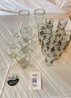 Group shot of all 16 pieces arranged on table